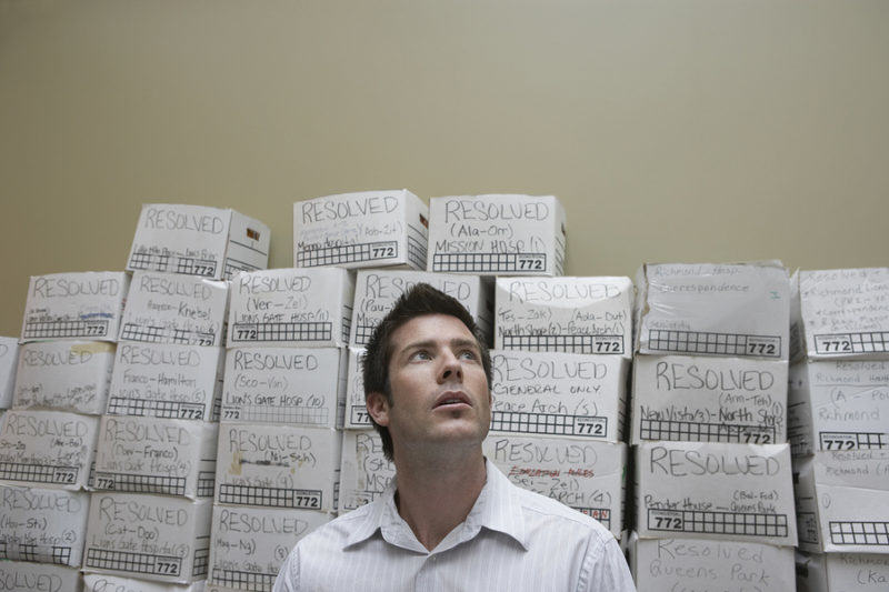 Businessman purging all his files in a One-Time Shredding at Absolute Data Shredding in Oklahoma